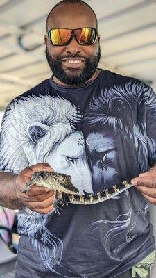 Holding a baby gator