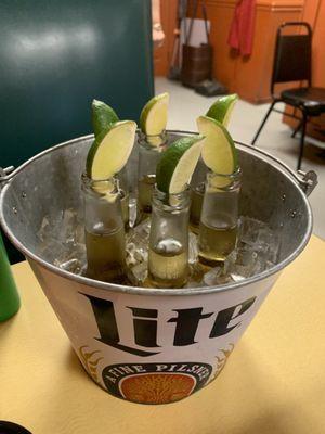 Bucket of Coronitas with lime