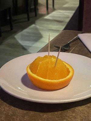 Complimentary orange slice after meal