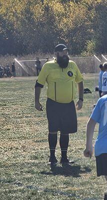 This ref could see past his stomach or facial hair. He was color blind and apparently has only refed pony league soccer before division 1.