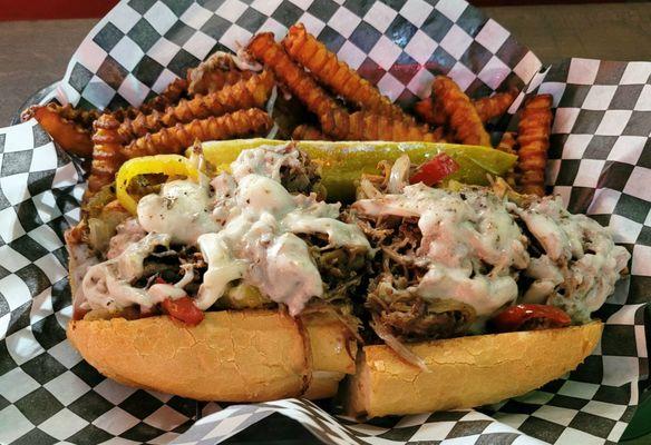 Philly cheesesteak with sweet potato fries.