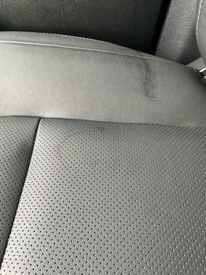 Oil/grease residue from employees feet on my new leather seats.