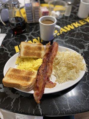 All American - toast, scrambled eggs, bacon, hash-browns, and coffee