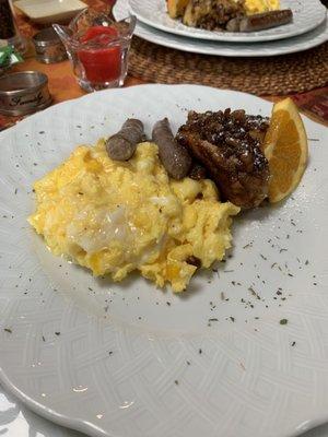 Cheesy eggs with French toast and sausage (but they cater to dietary needs!!)