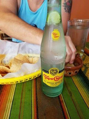 Complimentary chips & salsa and an ice cold Topo Chico.