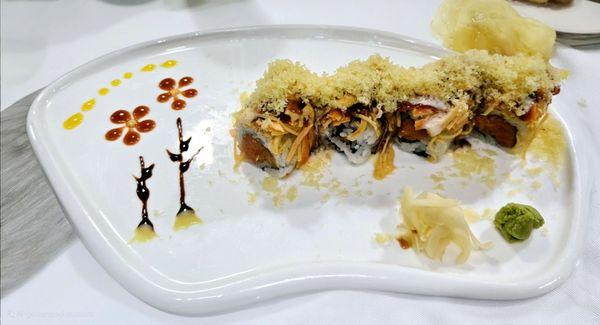 Crazy roll .spicy tuna spicy salmon inside top with spicy crabmeat house special sauce &crunch