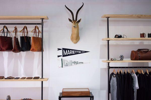 Retail shop: Totes, shirts, wallets, duffle bags, pennants, and Garry the Gazelle.