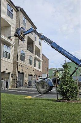 Using a forklift to move a grand piano to 3rd floor.