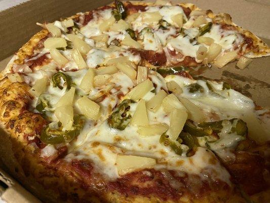 Medium pizza with a heaping piling of pineapple, onions, & jalapeño's.