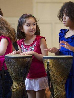 Your child will learn to drum in an ensemble in Rhythm Kids!