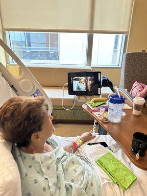 Watching Netflix on the iPad in her room