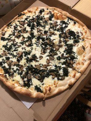 White pizza with no ricotta, spinach and mushrooms added.