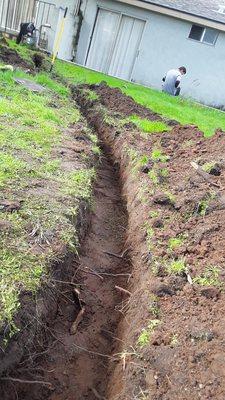 Hand dug trench, minimal yard invasiveness vs heavy equipment and we arent afraid to sweat if it saves tearing up your yard unnecessarilly