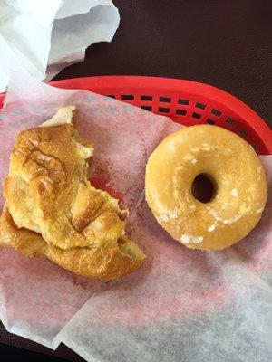 Turkey egg and cheese croissant sandwich with glazed donut. This is my new favorite breakfast spot! So affordable and Sam is so nice. Love!