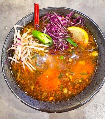 Spicy shrimp soup with flat rice noodles