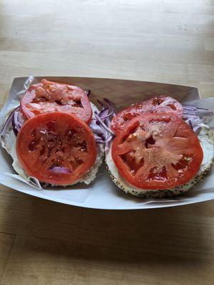 Everything bagel with tomato and onion