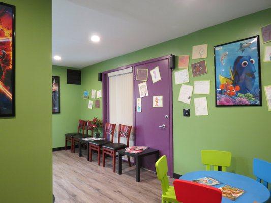 Waiting room for parents and children's play area.