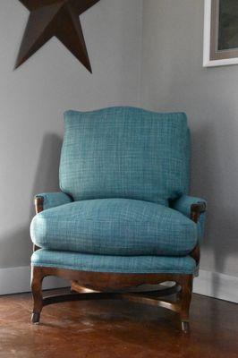 The chair was treated to a fresh upholstery makeover, complete with restuffed cushions filled with luxurious down feathers.