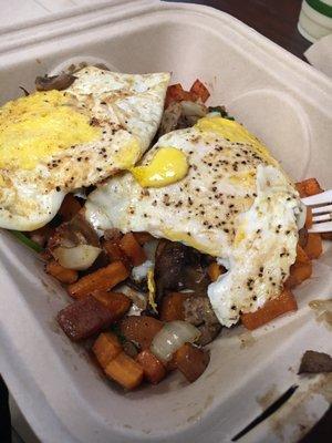 Sweet potato hash with eggs over hard.