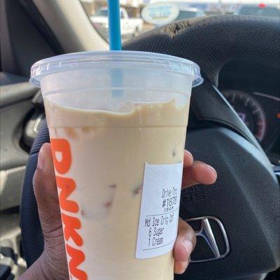 An ice coffee that looks too light for 1 cream and 6 sugars