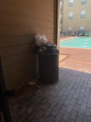 Trash piled up by pool not picked up for a week.