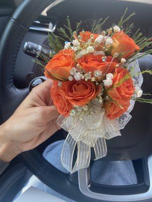 Orange roses with white and gold ribbon