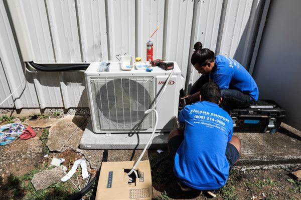 Our Technicians installing a new A/C system.