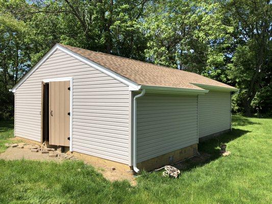 Completed addition, roof and siding