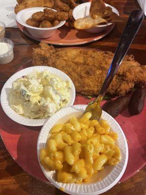 Flounder, potato salad, hush puppies, and Mac and cheese.