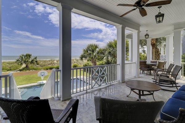 Relaxing porch overlooking your private pool and takin gin the direct ocean views.