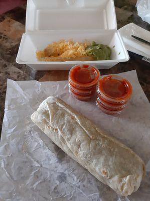 Carne asada burrito and 2 of the 3 rolled tacos with cheese and guacamole