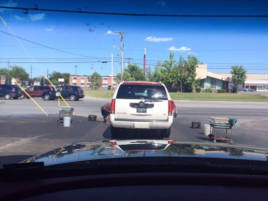 Hard to see it but there are ALWAYS two guys towel drying! This gets my car thoroughly dry before the next car comes.