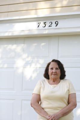 Our customer taking photo after fixing her garage door