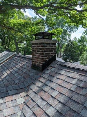 This chimney has been tuck pointed and we installed a custom chimney cover.