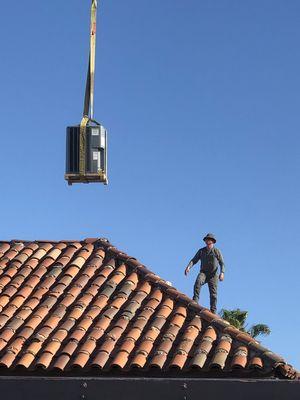 Crane lifting a new condenser