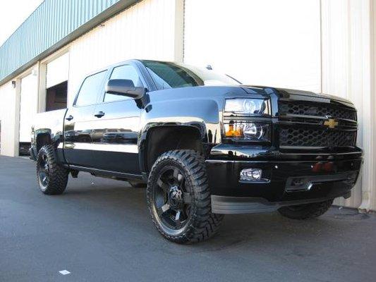 2015 Chevy 1500 color matched grill, bumpers headlight bezels on a 2.5'' leveling kit 20x9 Rockstar Wheels and 33'' Toyo Open Country M/t's