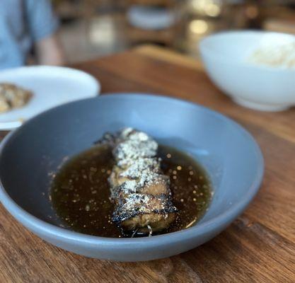 Mushroom skewer with whiskey-garlic glaze and mushroom broth