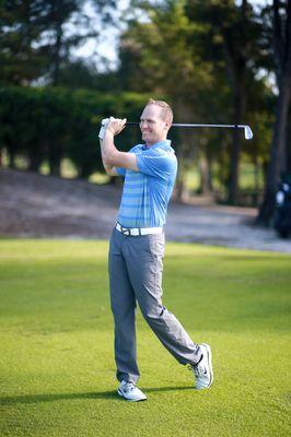 Mark Durland executing a golf shot.