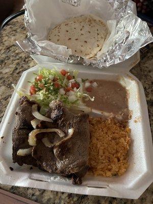 Steak rice and beans salad and flour tortillas