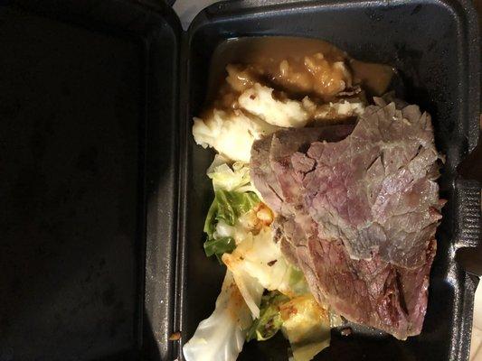 Thin jerky like corned beef, barely cooked cabbage and mashed potatoes w/gravy.