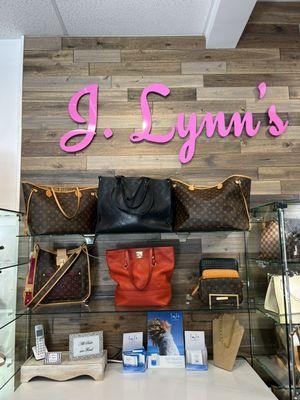 Handbags behind checkout counter