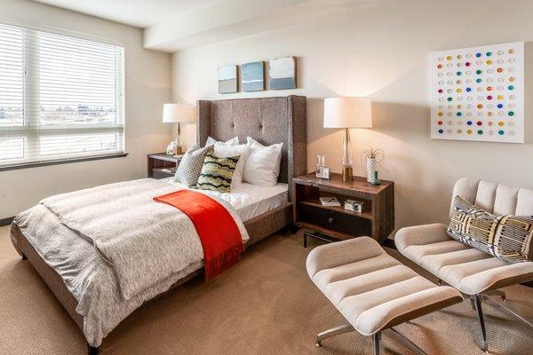 Staged bedroom with oversized windows.