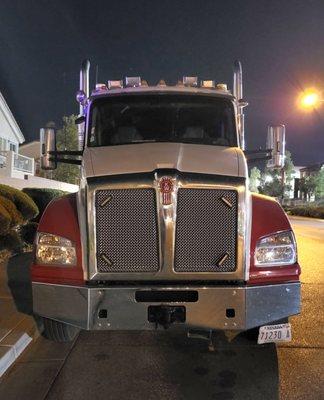 Red and white Kenworth truck. License plate # 71230 A . Truck # 602