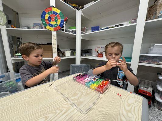 My boys get to work on their fine motor skills with threading /beading activity