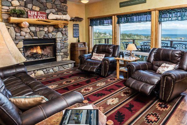 Cozy up in front of the river rock fireplace.