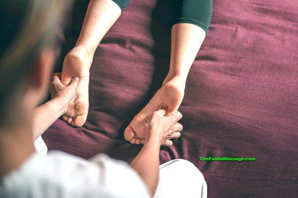 Foot reflexology technique in action