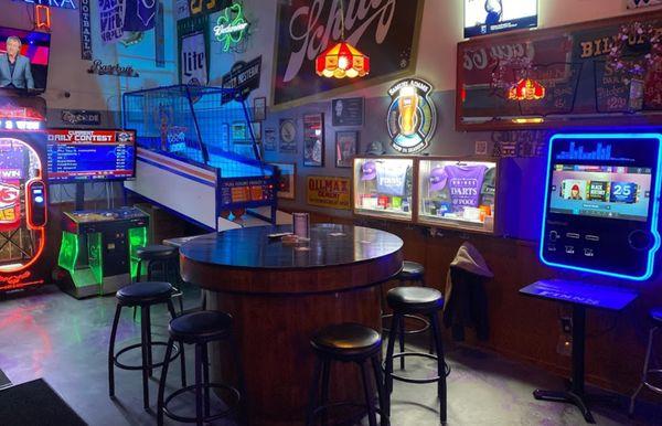 Back seating area with arcade games, and jukebox.