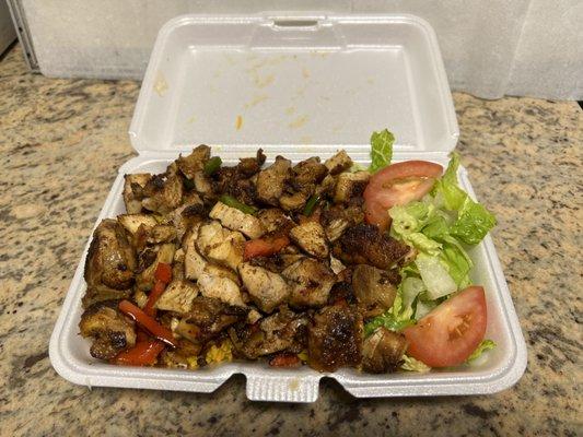 Pepper chicken over rice and salad