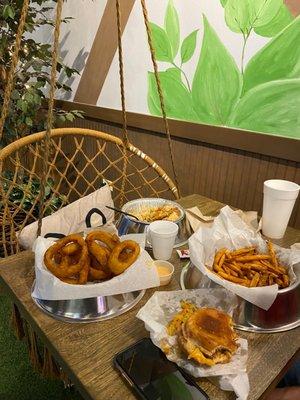 Onion rings, burger, fries, spicy Thai bowl