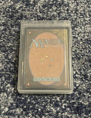 Magic: The Gathering cards in a plastic deck box